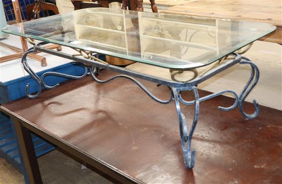 A wrought iron framed coffee table, with plate glass top W.120cm